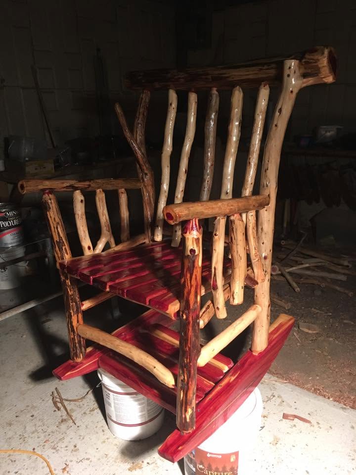 Cedar log rocking chair with cushioned seat