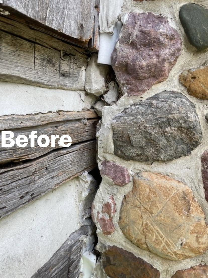Before: failed chinking and deteriorated corner on historic log cabin