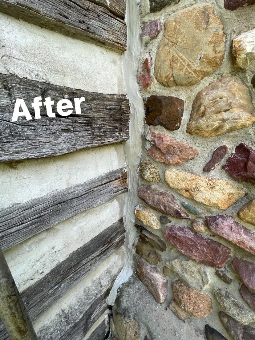 After: restored corner with fresh chinking, original logs preserved
