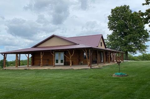 Sticks & Stones hand-notched cedar log cabin work